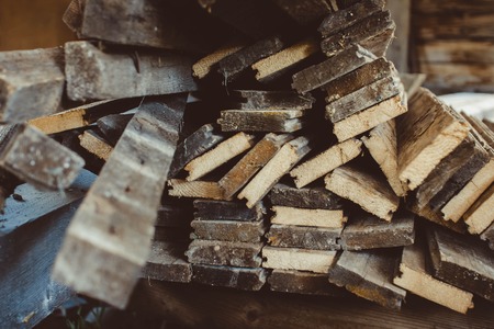 Background of horizontally lying raw rough wooden planks with bark closeup Reklamní fotografie