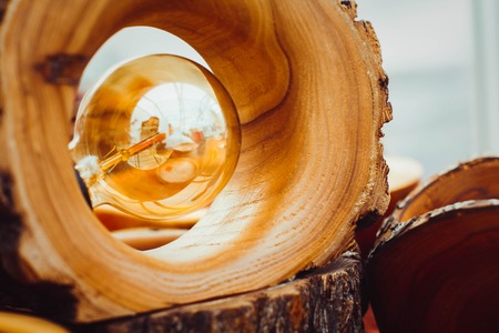 Old light bulb stuck in a wooden lamp