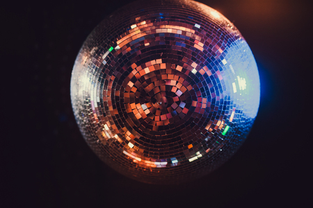 Disco ball with bright rays night party background photo
