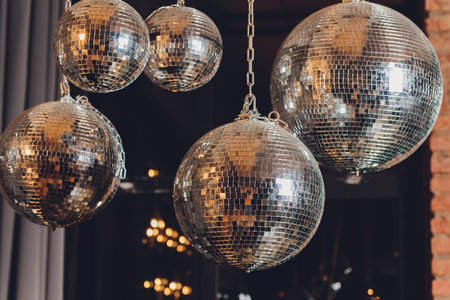 Sparkly disco ball hanging in an empty grungy room