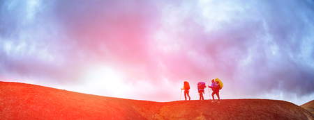 Hikers on the trail in the islandic mountains trek in national park landmannalaugar iceland