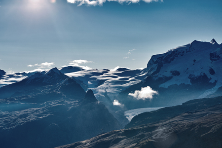 Snow capped mountains summits of the mountains view of the alpine mountains at the sunrise trek near matterhorn mount