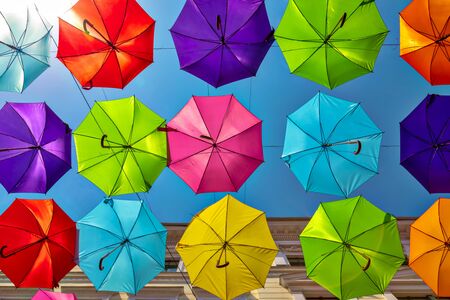 Looking up at the colorful umbrellas festive street decoration