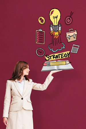 Businesswoman showing a book against red background