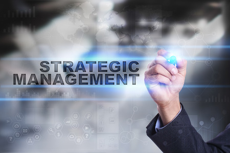 Businessman is drawing on virtual screen strategic management concept