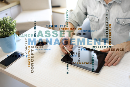 Asset management on the virtual screen business concept words cloud Stock Photo