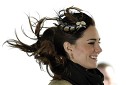The wind blows Kate Middleton's hair as she and her fiancee Prince William attend a ship naming ceremony for the Hereford Endeavour at Trearddur Bay Lifeboat Station, in Trearddur Bay, Anglesey in north Wales February 24, 2011