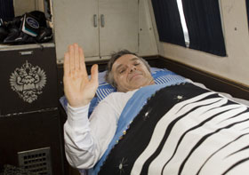 Canadian astronaut Bob Thirsk waves as he rests inside a vehicle of the Russian Space Agency following his landing in December 2009 in northern Kazakhstan after six months in orbit. 