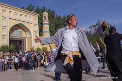 People dance to observe Eid al Adha in Xinjiang