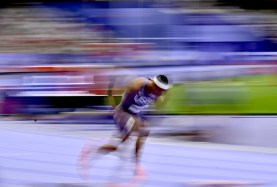 Norman delivered the fastest time ever in the opening round of the Olympic 400 meters on Sunday.