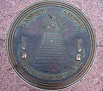 Reverse side of the Great Seal, as depicted by a plaque in Freedom Plaza in 2006