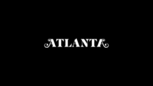 On a black background, the word Atlanta is written in white block capital letters, the first and last letter A have extra stylized curls.