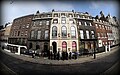 The facade of Sir John Soane's Museum, note the queue. You should switch off your mobile phone. No photography is allowed. You should put your hand bag, camera, etc within a plastic bag at the entry of the building