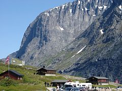 Stigrøra with souvenir sale. In the background the rock formation Trollklørne.