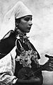 Image 11A Berber musician wearing two large triangular brooches in southern Morocco (early 20th century photo) (from Culture of Morocco)