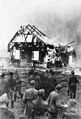Image 103German soldiers and locals watch a Lithuanian synagogue burn in 1941. (from History of Lithuania)