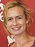 Sandrine Bonnaire at the 2009 Venice Film Festival, looking to the front and smiling