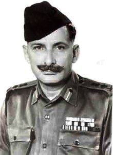 Photograph of Manekshaw from the chest up wearing his army uniform, medals and cap