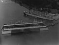 Aerial view of dry dock Dewey with USS Jason (AV-2) nearby, October 1928