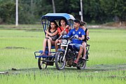 Transportation of three tourists by tuk-tuk in Don Det.