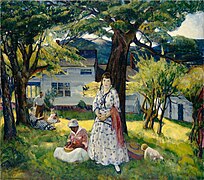 A white family with a black woman are in a lightly forested area in front of a house. In the background is a mountain range.