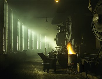 Steam locomotives of the Chicago & North Western Railway in the roundhouse at the Chicago, Illinois rail yards.