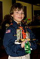 Image 8A happy Cub Scout holds a winning pine car