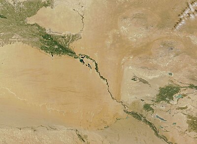 A topographic map showing the Amu Darya river and Bukhara Oasis map. Amu Darya flows from the top left corner to the bottom centre. In the bottom left corner of the map lies the Bukhara Oasis.