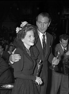 Photo of Joan Fontaine and Gary Cooper at the Academy Awards holding their Oscars