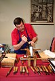 Image 9A traditional bookbinder at work (from Bookbinding)