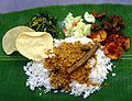 Image 62A typical serving of banana leaf rice. (from Malaysian cuisine)