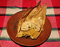 Tamale filled with chicken and salsa verde.