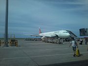 A PAL Express Airbus A321-200 is embarking passengers on a flight bound for Manila.