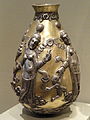 The "Anahita Vessel", c. 300-500, gilted silver: the female dancers may be Zoroastrian religious images or bacchantes, followers of the cult of the wine god Bacchus[21]