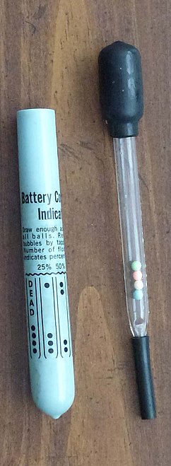 Battery condition indicator to measure the density of the electrolyte in a lead–acid battery, indicating the charge of the battery (~1985)