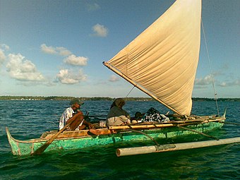 A modern undecorated tondaan without the prow and stern extensions and with a plain sail from the Bajau of Sabah