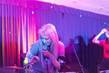 Sarah Midori Perry looking at an animatronic bird