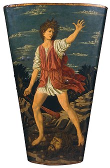 David holding a slingshot with Goliath's head on the ground