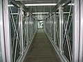 Interior of a modern glass-walled bridge at Incheon Airport, South Korea