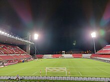 The Brianteo stadium during the nighttime, with the grandstand on the left