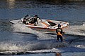 A motorboat pulling a waterskier