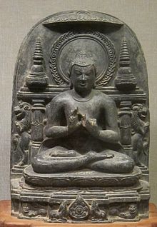 A sculpture of Buddha sitting