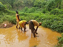 "Illegal Gold mining Nigeria1" by Dame Yinka is licensed under CC BY-SA 4.0.