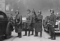 Blösche at right, 2nd from right is Heinrich Klaustermeyer, Jürgen Stroop at center, watching housing blocks burn during the Warsaw Ghetto Uprising. Picture taken at Nowolipie street looking East, near intersection with Smocza street. On the left burning balcony of the townhouse Nowolipie 66.