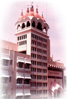 a multi-story building with an ornate roof