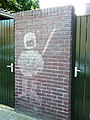 Graffiti van een ME-agent bij de Piersonstraat