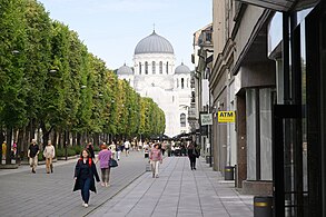 Laisvės Alėja with St. Michael the Archangel's church in the background