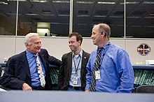 Aldrin (in a suit and tie) chats with Byerly and Spencer.