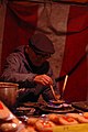 A street seller in Asakusa Tokyo offering hand-made karumeyaki