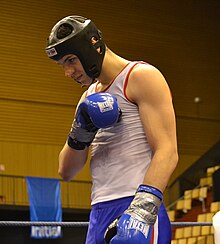 A young competitor executing the savate salute